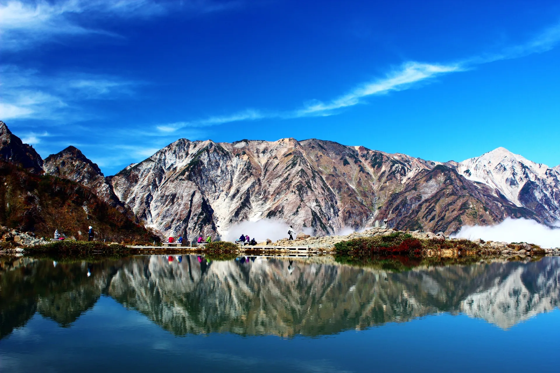 Happo Pond reflecting the Hakuba Sanzan peaks — crystal-clear mirror lake at 2,060m